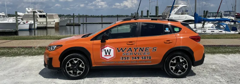 Wayne's Appliance Services orange service vehicle - reliable appliance repair throughout Eastern North Carolina